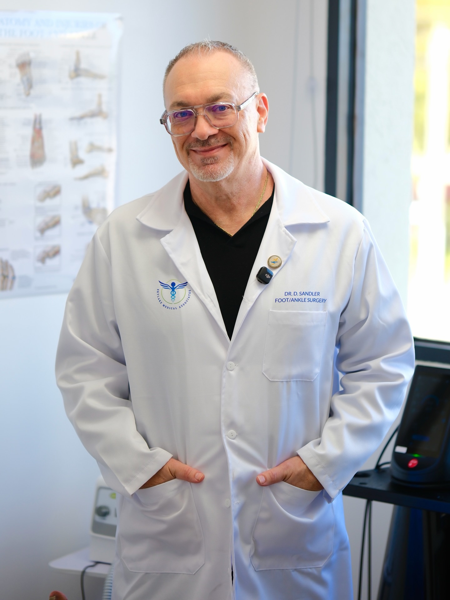 Dr. Dmitry Sandler giving a young patient a thumbs-up after a procedure